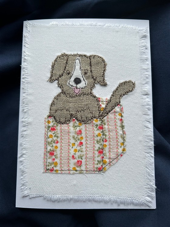 puppy present greeting card in flower box