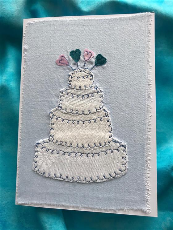 celebrations cake wedding card on pale blue