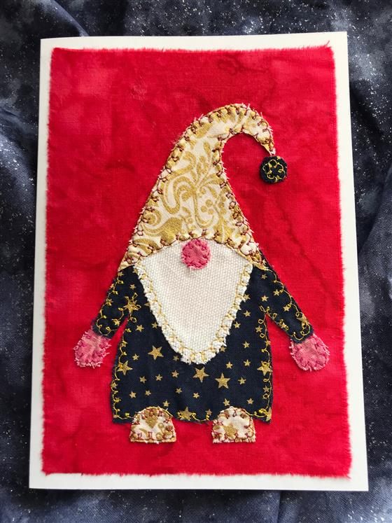 navy and gold festive gnome christmas card on red