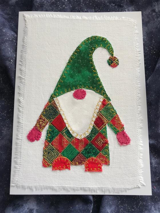 red and green festive gnome christmas card on white