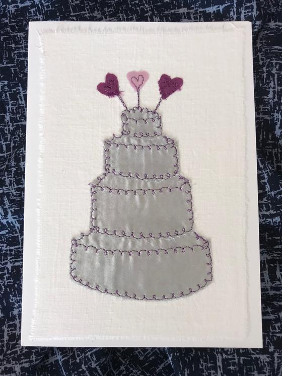 silver wedding cake on white greeting card