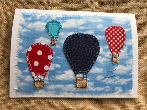 hot air balloons in blue and red greeting card