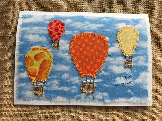 hot air balloons in orange and yellow greeting card