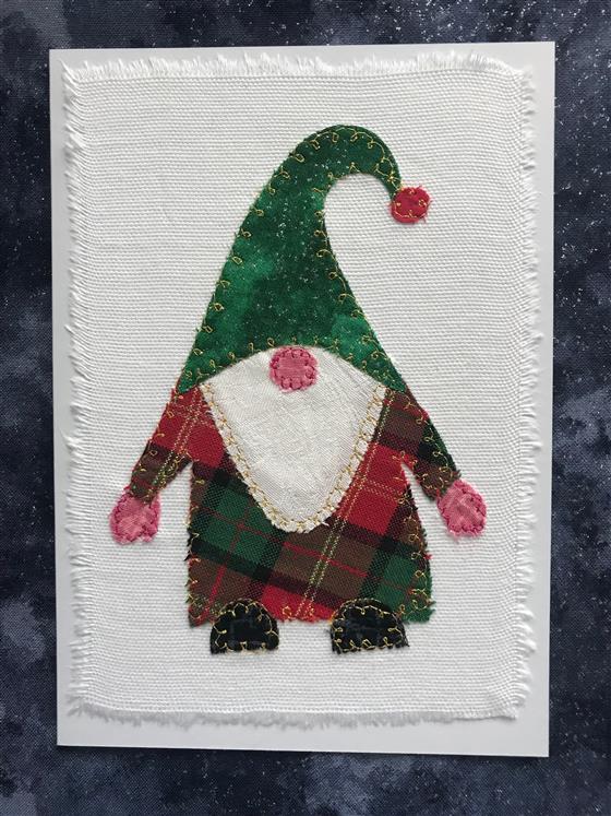 red and green festive gnome christmas card on white