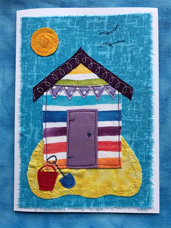 rainbow beach hut card on blue