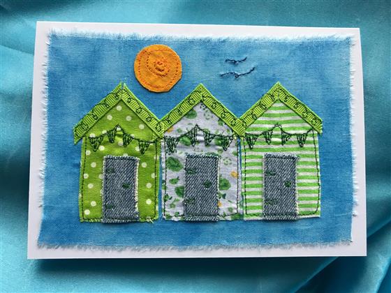 blue sky beach hut trio greeting card in green