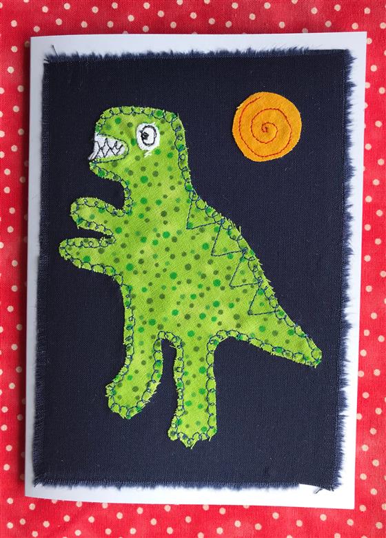 green spotty t rex greeting card on navy