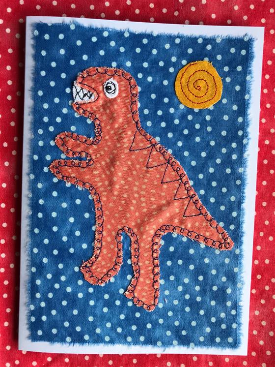 orange t rex on blue spots dinosaur greeting card