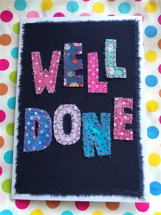 well done pink and blue spotty card on navy