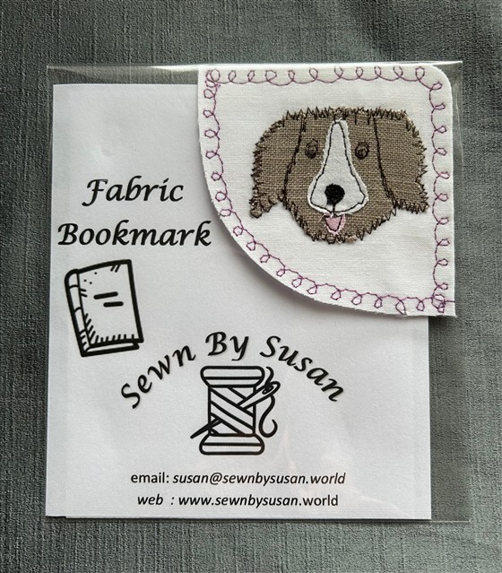 corner bookmark - brown puppy on white fabric