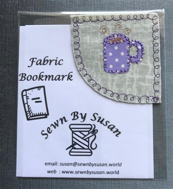 corner bookmark - lilac mug on grey fabric