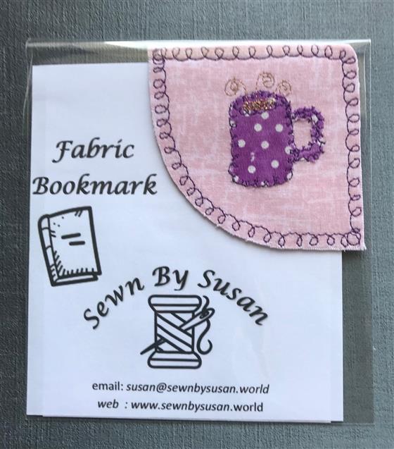 corner bookmark - purple mug on pink fabric