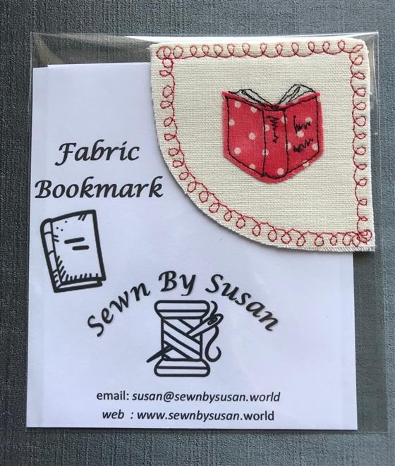 corner bookmark - red book on cream fabric