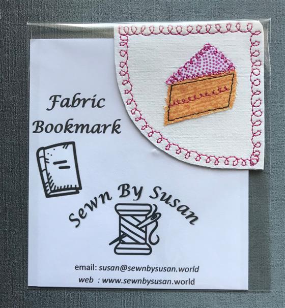 corner bookmark - slice of cake on white fabric